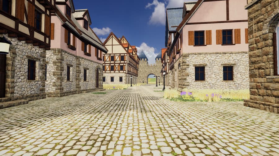 A cobbled street of half-timbered houses leading to a gatehouse